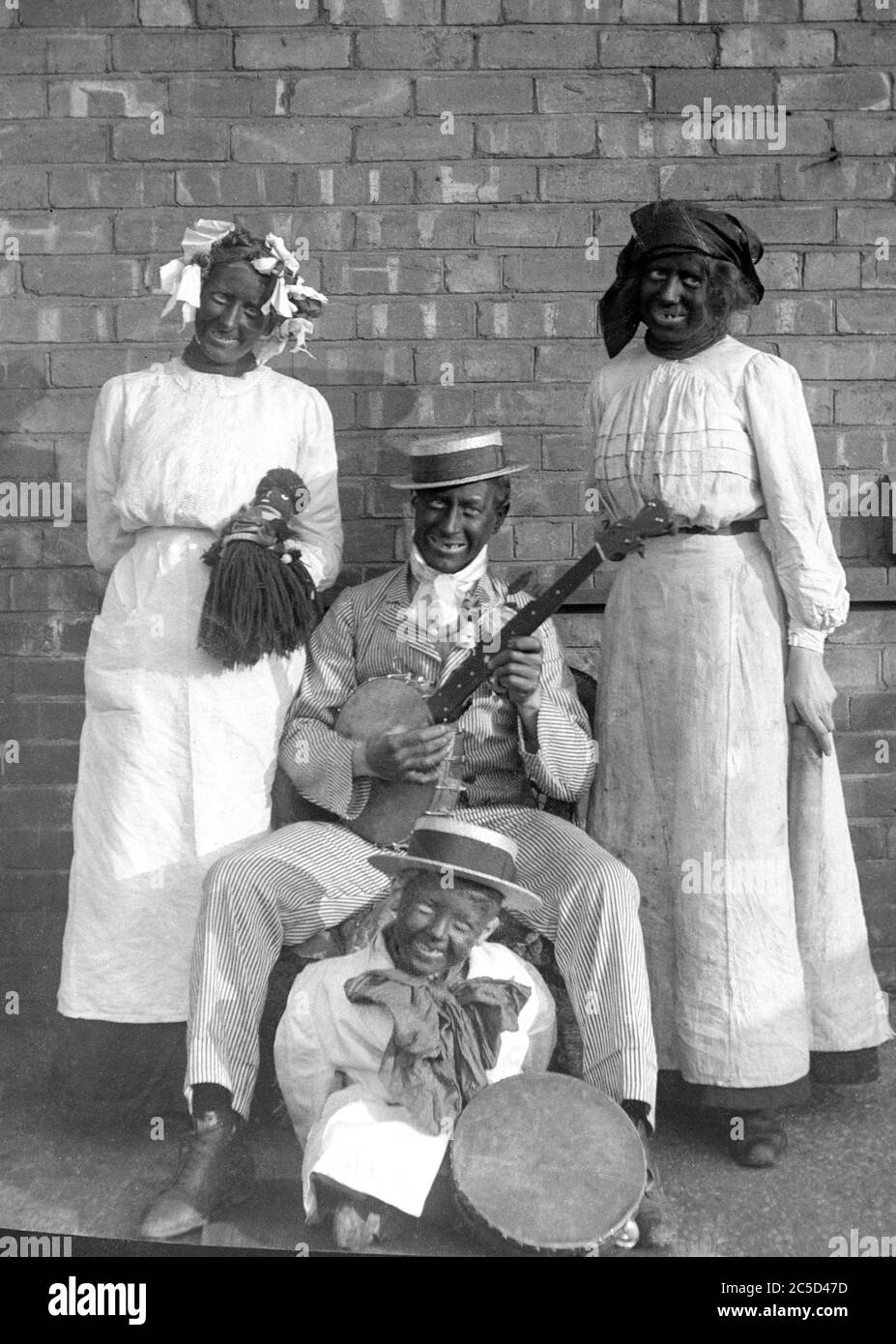 Archive image of children in blackface circa 1930, with instruments. Stock Photo