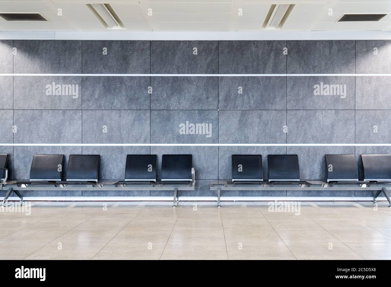 A group of seats in a clean nice decorated waiting hall at terminal, airport, mall or a hospital. High quality photo Stock Photo