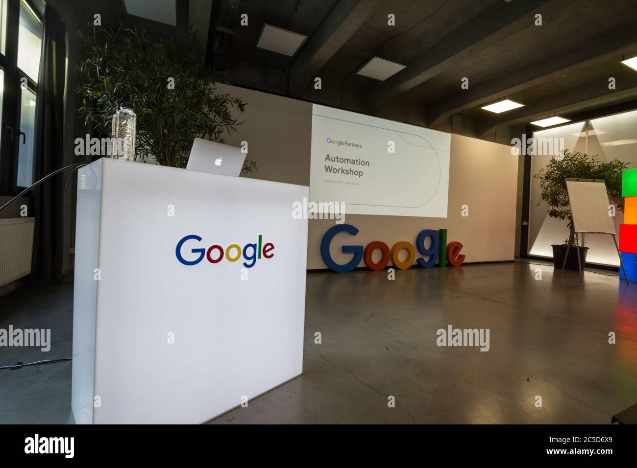 BUCHAREST, ROMANIA - FEBRUARY 12, 2020: Google Partners logo in front of a stand promoting Google Ads automation strategies, aimed at automating biddi Stock Photo