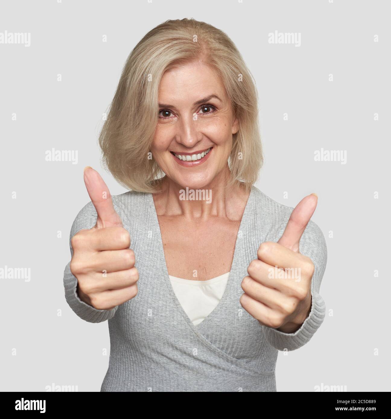 Old lady showing thumbs up hi-res stock photography and images - Alamy