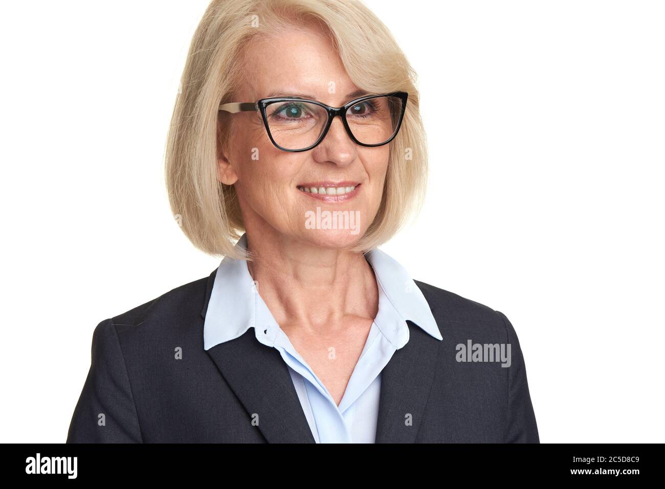 Mature woman in suit wearing glasses looking away. Isolated on white Stock Photo