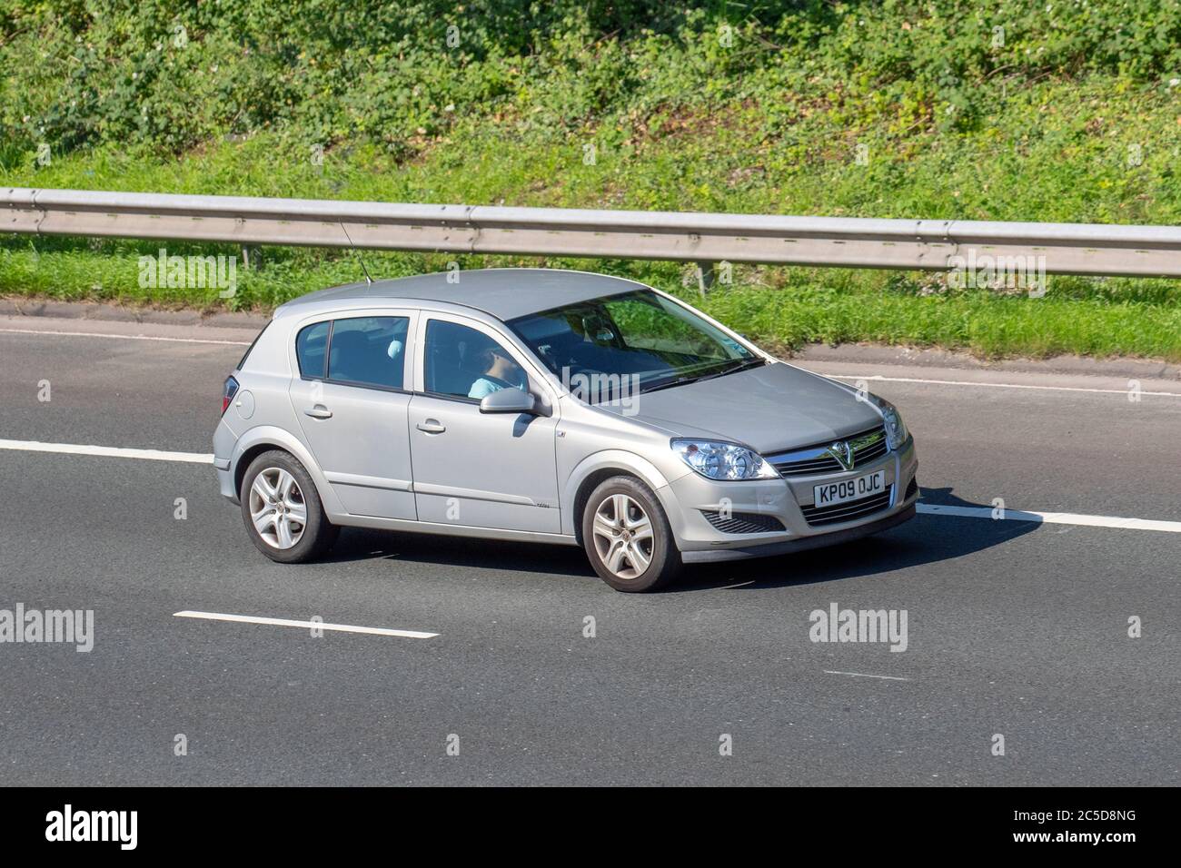 2009 silver Vauxhall Astra Club Twinport; Vehicular traffic moving vehicles, cars driving vehicle on UK roads, motors, motoring on the M6 motorway highway network. Stock Photo