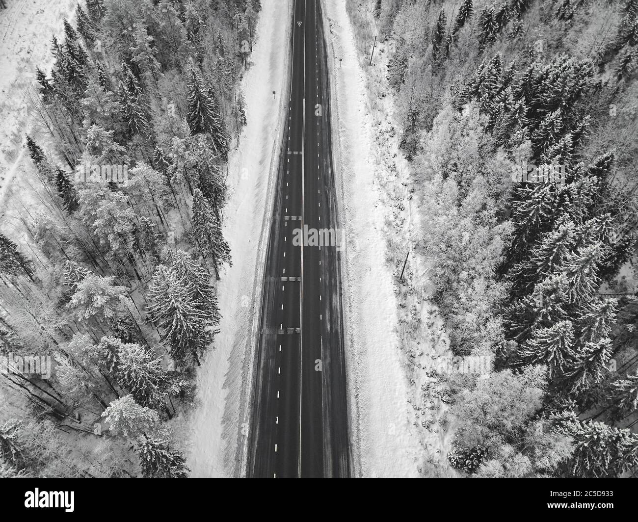 Aerial view of road in the forest in winter Stock Photo - Alamy