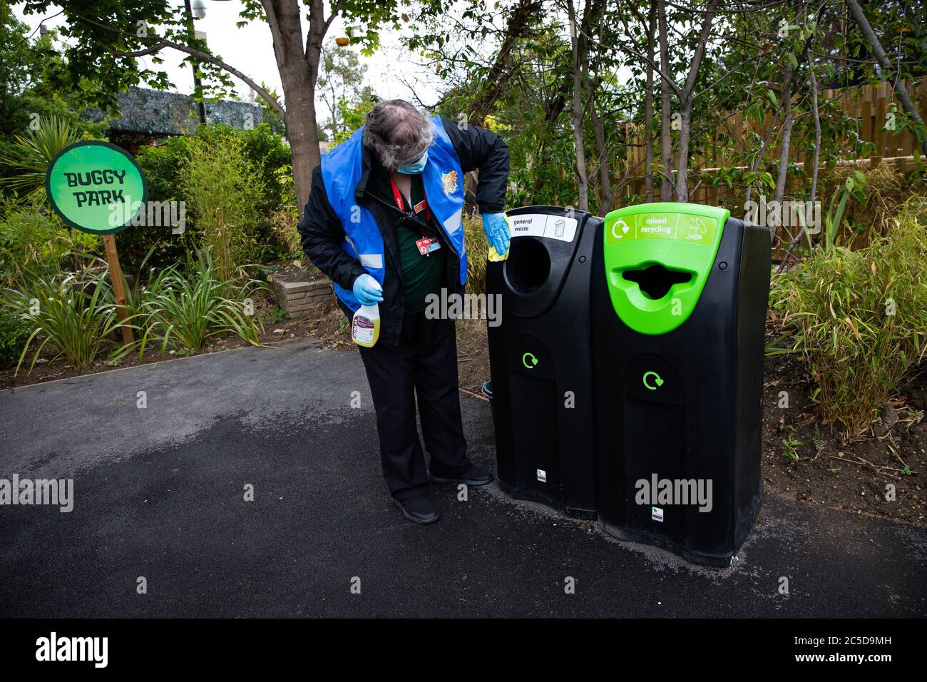 A bin is wiped clean at Chessington World of Adventures in Surrey, as staff make final preparations ahead of reopening to members of the public when the lifting of further lockdown restrictions in England comes into effect on Saturday. Stock Photo