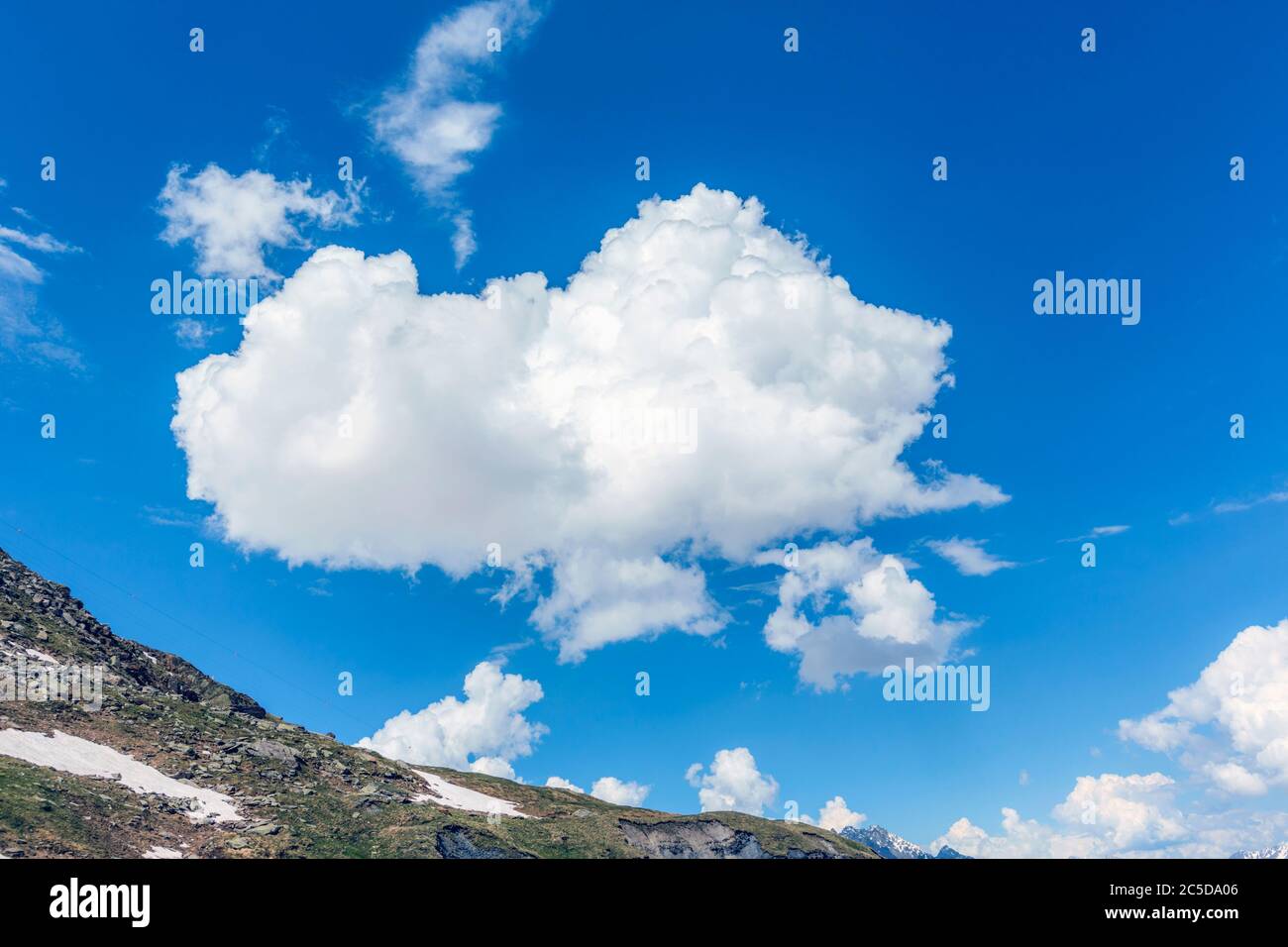 Cumulus cloud in Swiss Alps, Switzerland. Stock Photo