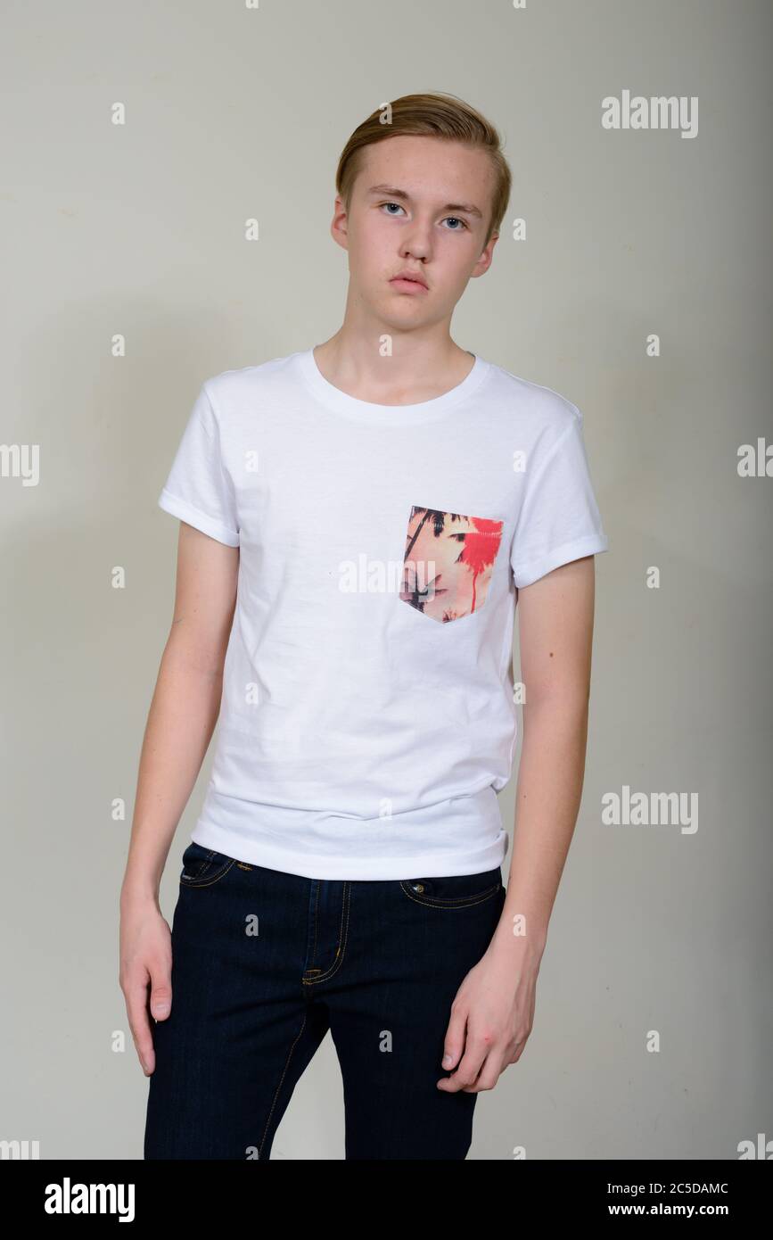 Portrait of young handsome blond teenage boy standing Stock Photo - Alamy