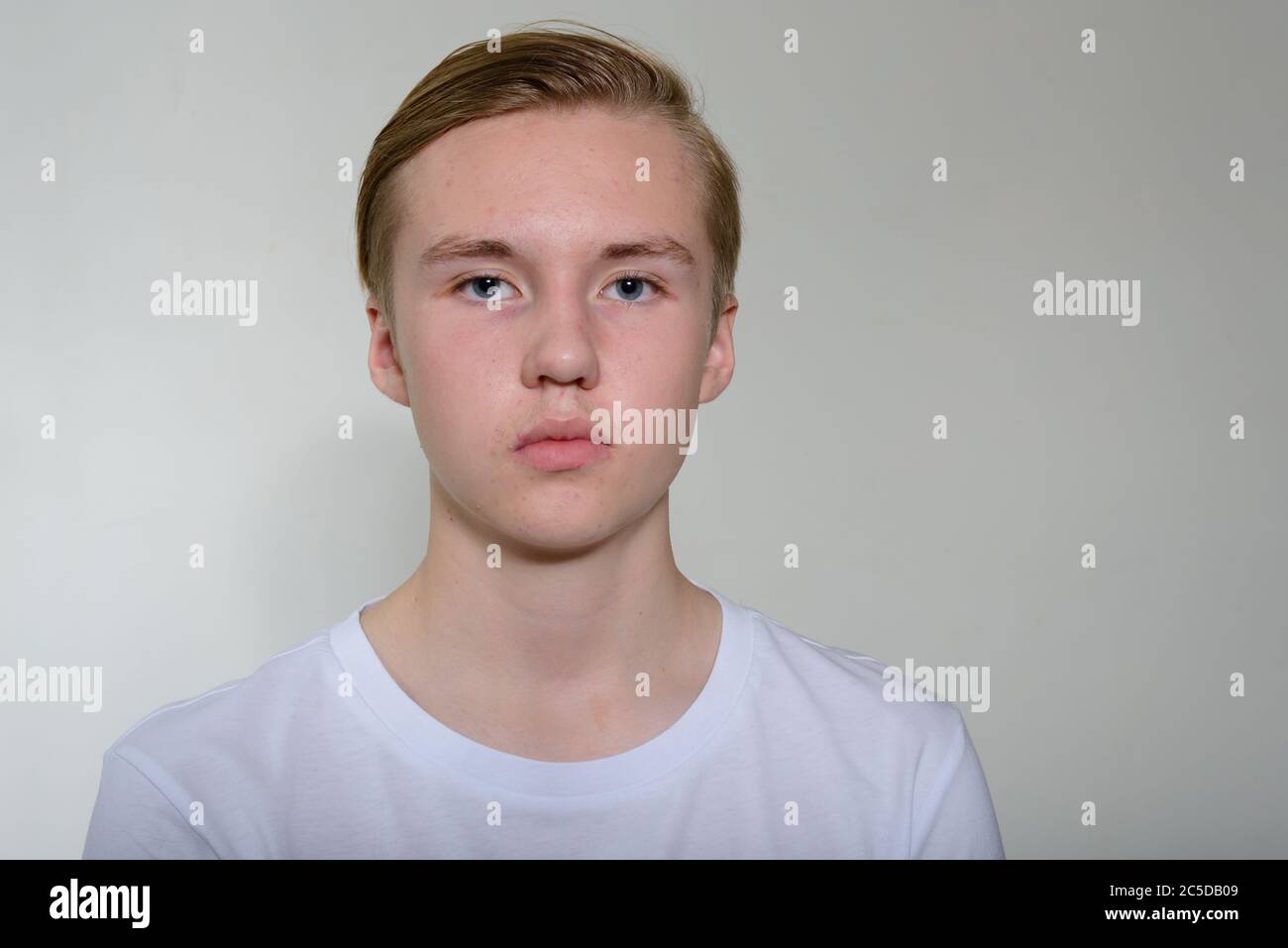 Face of young handsome blond teenage boy Stock Photo - Alamy