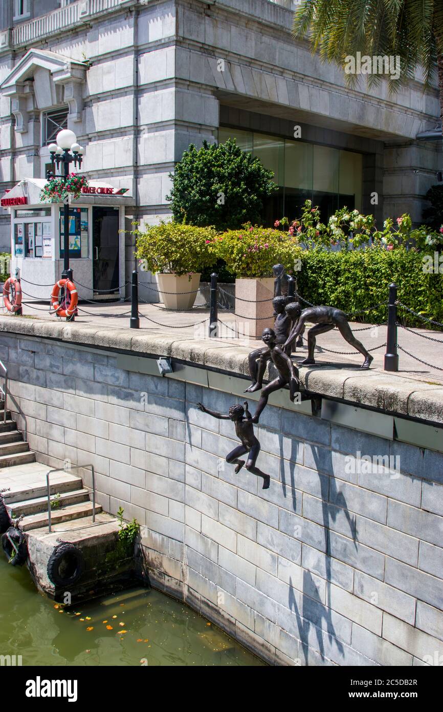 The Five Boys By The River, part of PEOPLE OF THE RIVER STATUE SERIES in Singapore. Stock Photo