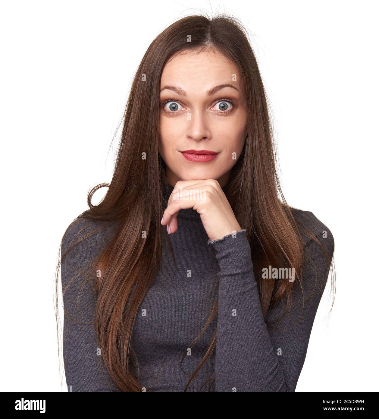 Surprised pretty woman with wide opened eyes looking at you. Isolated on white studio background