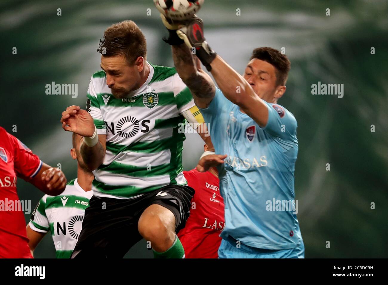 Lisbon, Wednesday. 1st July, 2020. Sebastian Coates (L) of Sporting vies with Denis, goalkeeper of Gil Vicente during a Portuguese League football match between Sporting CP and Gil Vicente in Lisbon, Portugal, Wednesday, July 1, 2020. Credit: Pedro Fiuza/Xinhua/Alamy Live News Stock Photo