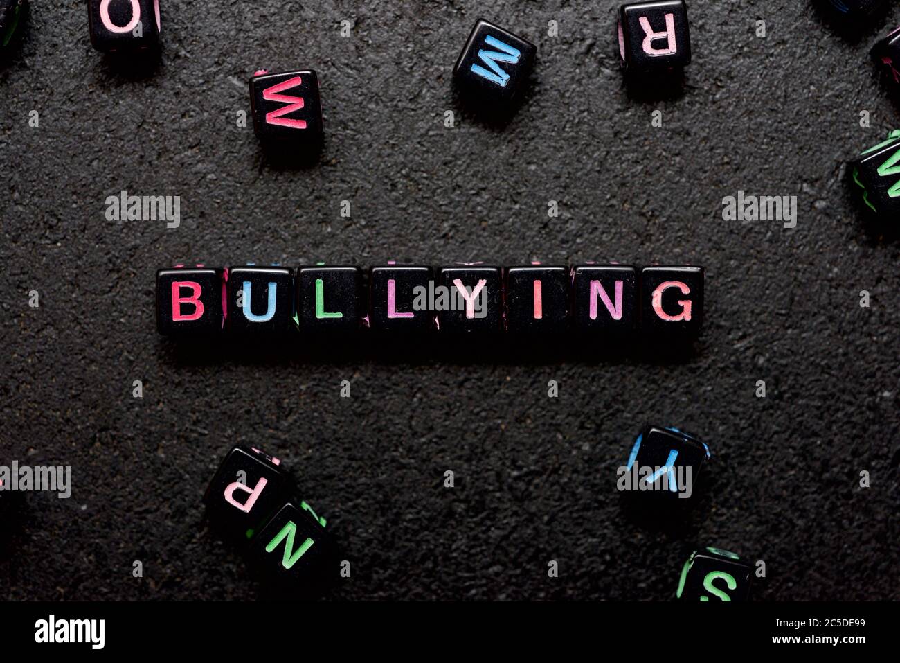 Bullying word on a black table. Stock Photo