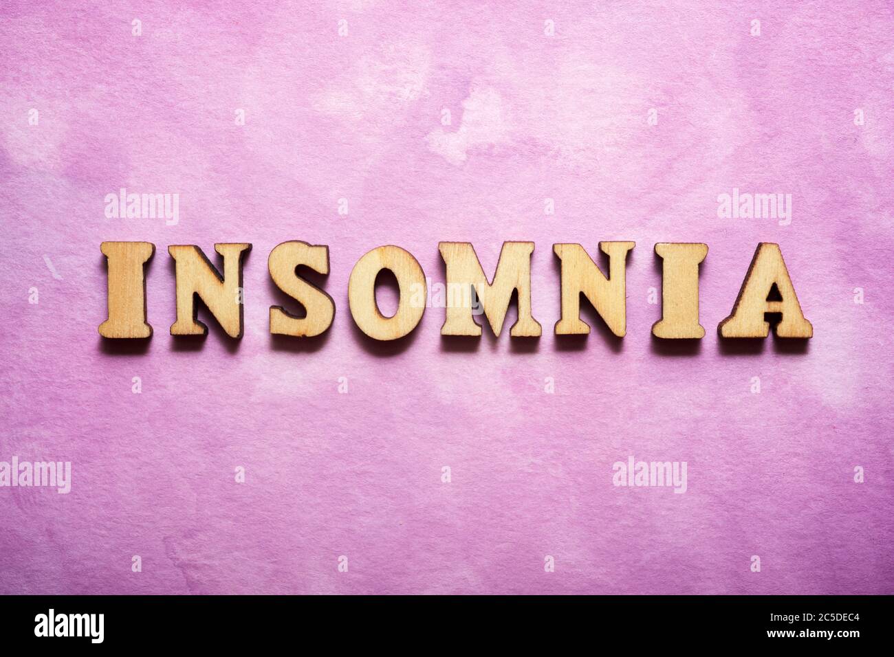 Insomnia text on a colored paper. Stock Photo
