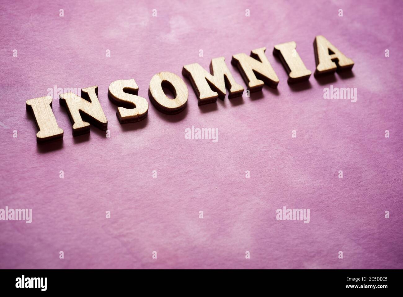 Insomnia text on a colored paper. Stock Photo