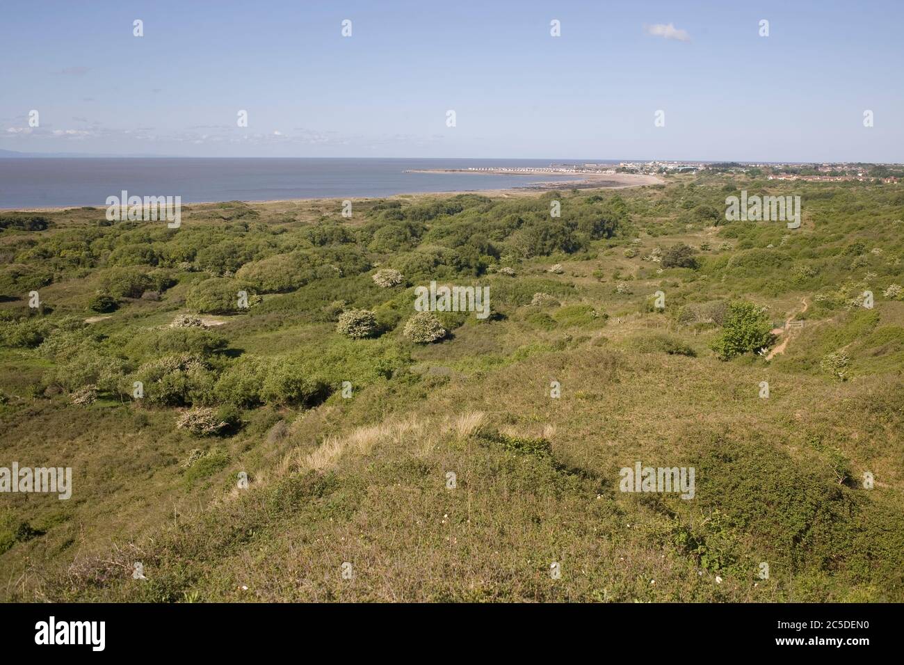 View from a hill in Merthry Mawr warren national nature reserve of Glamorgan heritage coast with Porthcawl in distance Stock Photo