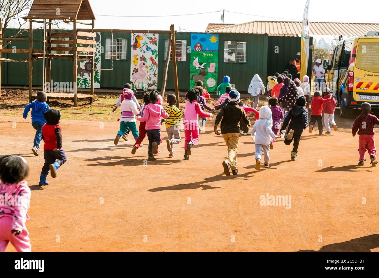 Soweto, South Africa - July 18, 2016: Young African Preschool kids playing in the playground of a kindergarten school Stock Photo