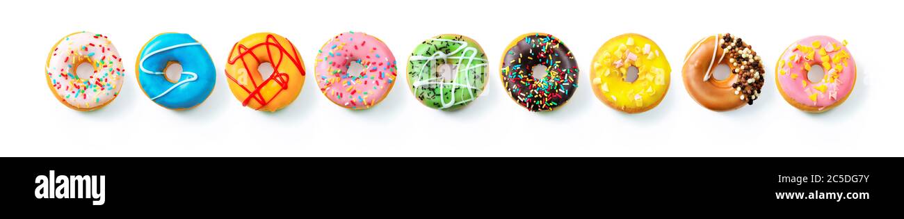 Various colourful donuts in a row isolated on white background Stock Photo