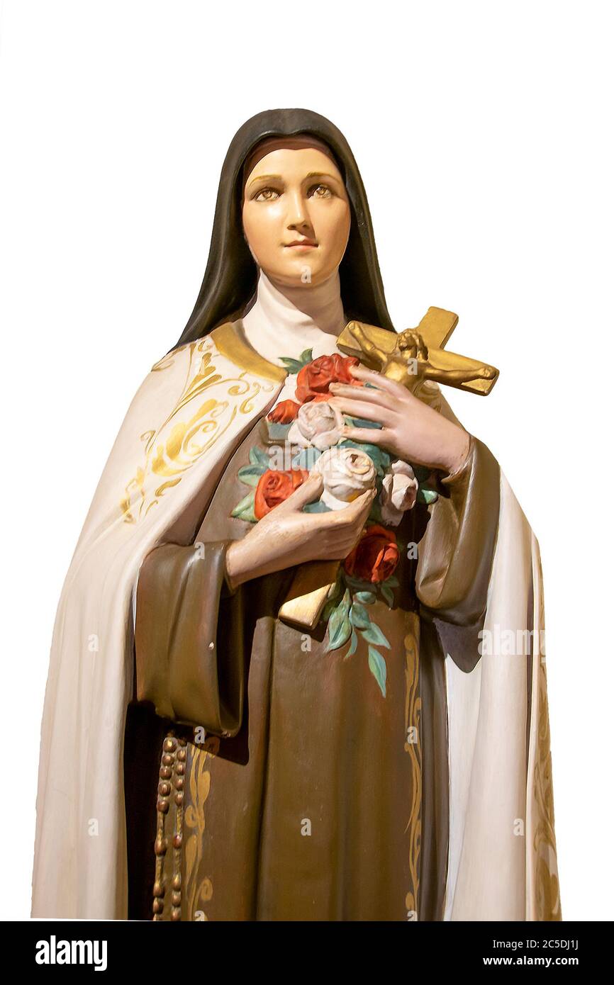 Woman saint sculpture holding a cross over white background Stock Photo