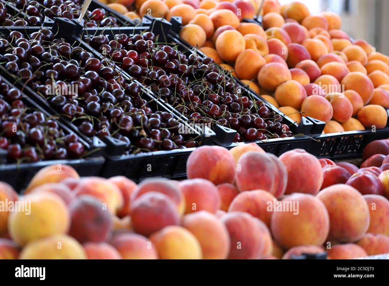 Cherries, peaches, nectarines and apricots on a market. Fruits pattern Stock Photo