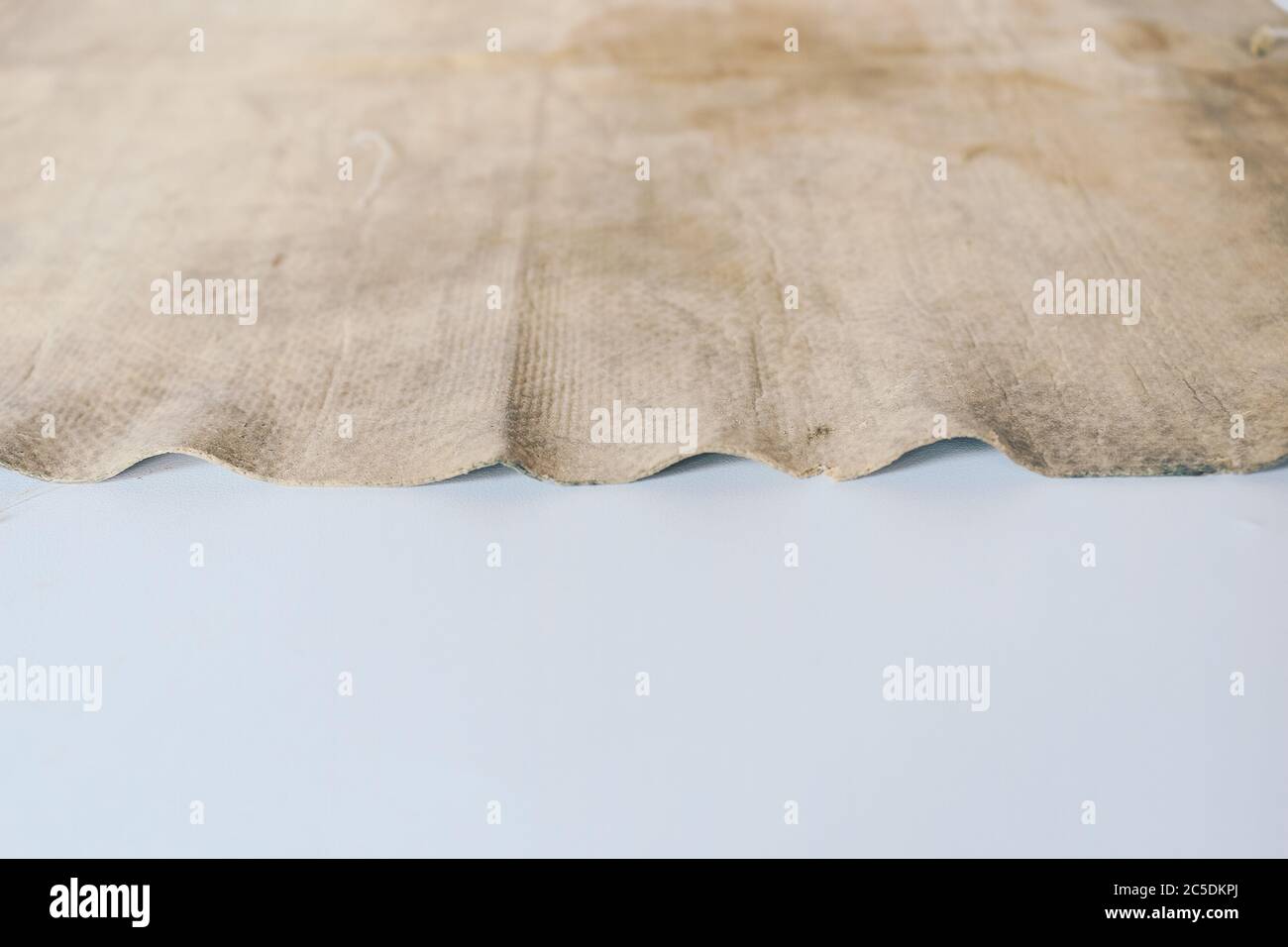 Dirty cleaning rag background texture in white background. Kanebo or