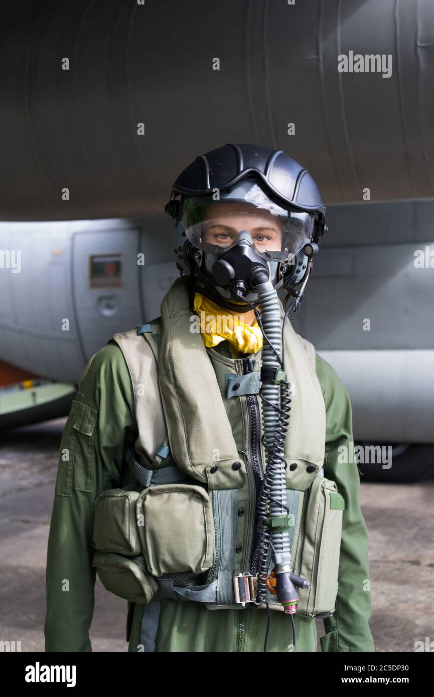 Figurine of fighter pilot in front of military plane. Mannequin is wearing  flight suit - helmet, mask for breathing, overall, vest. Direct look Stock  Photo - Alamy