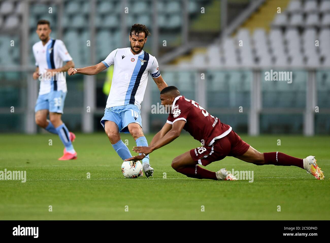 Turin, Italy. 30th June, 2020. TURIN, ITALY - June 30, 2020: Marco Parolo of SS Lazio competes for the ball with Gleison Bremer of Torino FC during the Serie A football match between Torino FC and SS Lazio. (Photo by Nicolò Campo/Sipa USA) Credit: Sipa USA/Alamy Live News Stock Photo