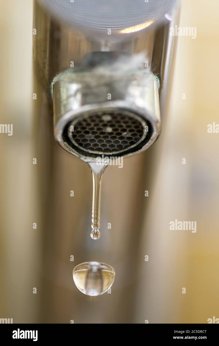 Macro shot of a dripping water tap Stock Photo