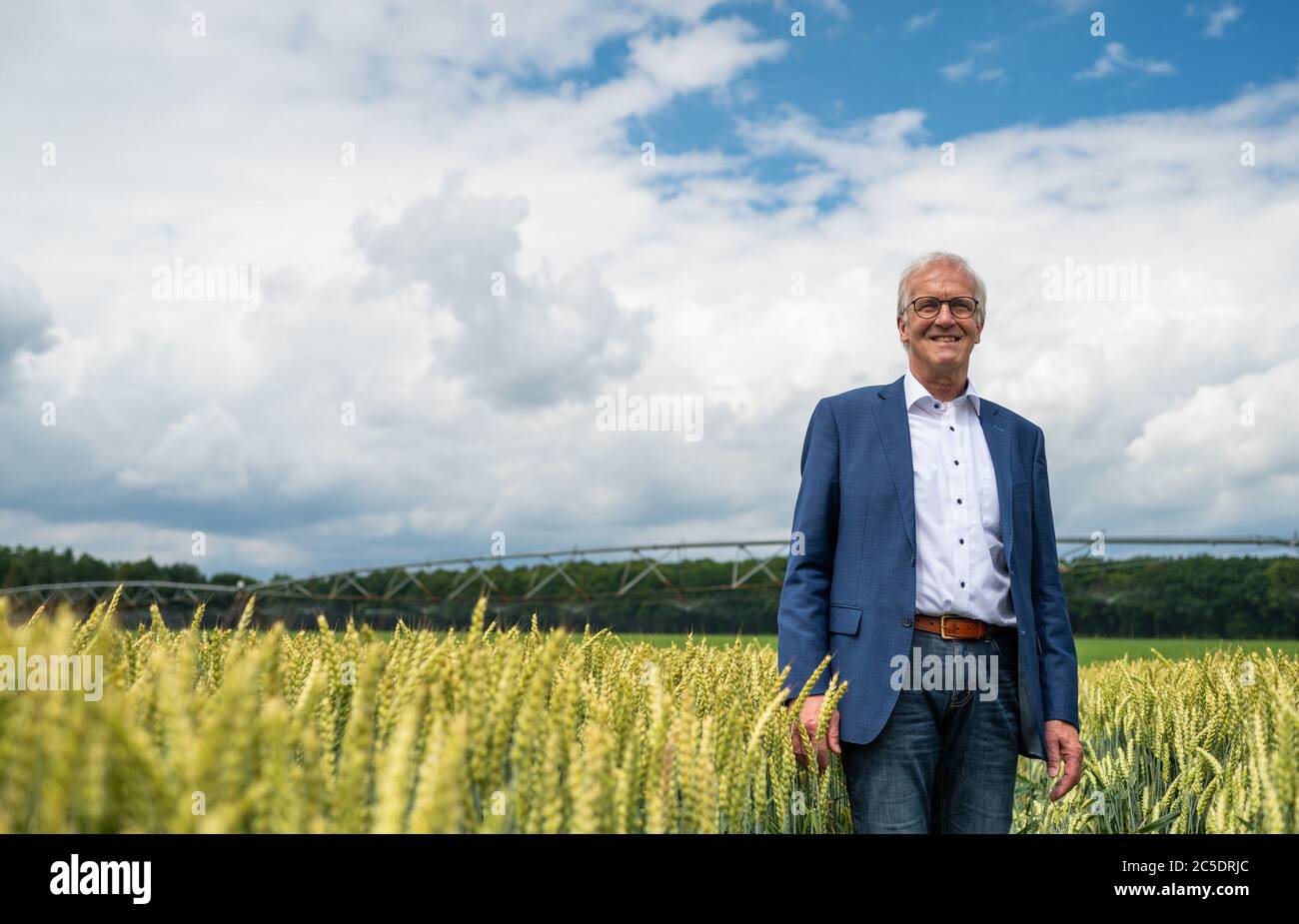 02 July 2020, Lower Saxony, Veerßen: Albert Schulte to Brinke, president of the Lower Saxony Landvolk, stands in a wheat field during a field inspection by the Landvolk Niedersachsen. Photo: Philipp Schulze/dpa Stock Photo