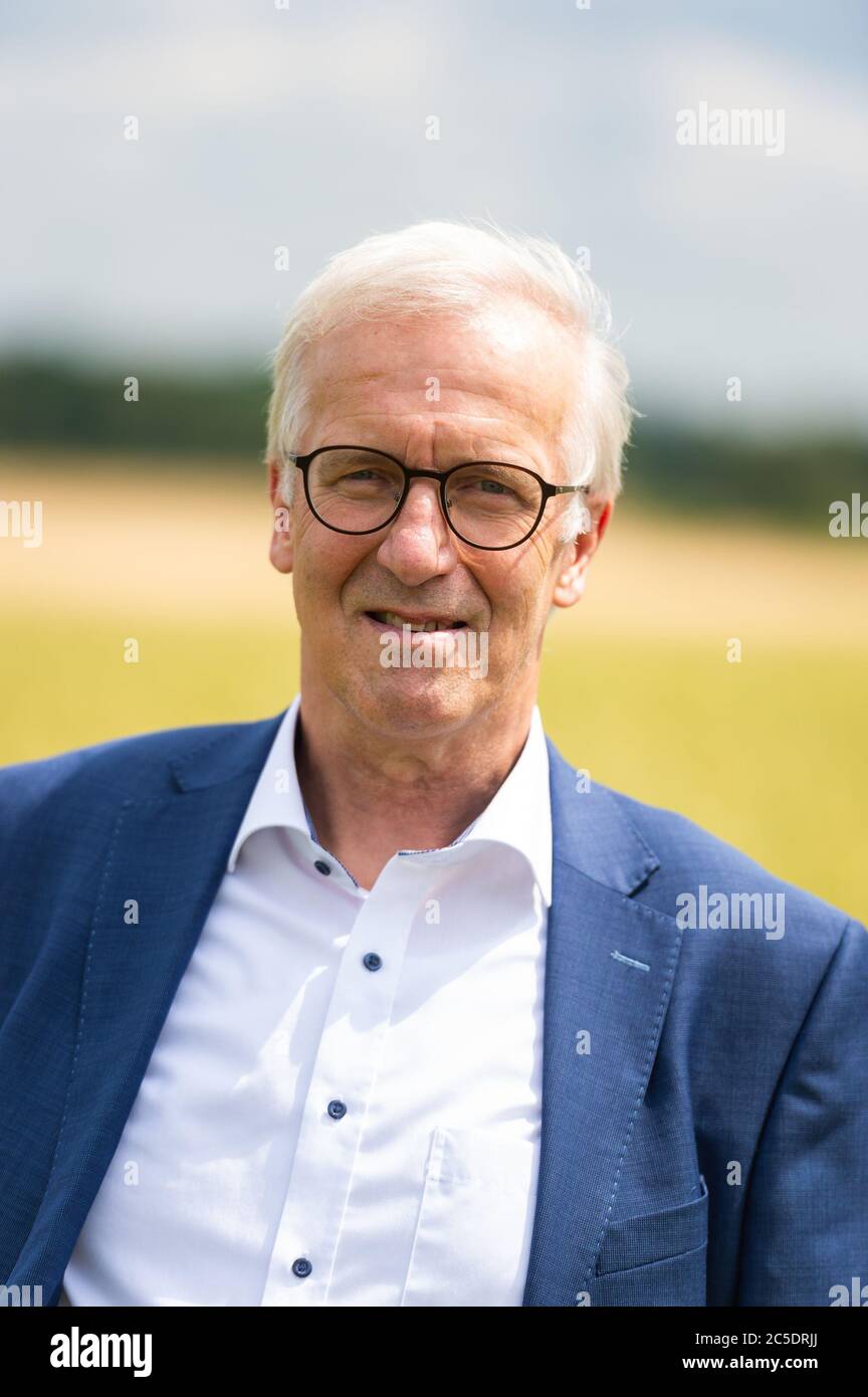 02 July 2020, Lower Saxony, Veerßen: Albert Schulte to Brinke, President of the Professional Association of the Rural People of Lower Saxony, stands in a wheat field during a field inspection by the Rural People of Lower Saxony. Photo: Philipp Schulze/dpa Stock Photo