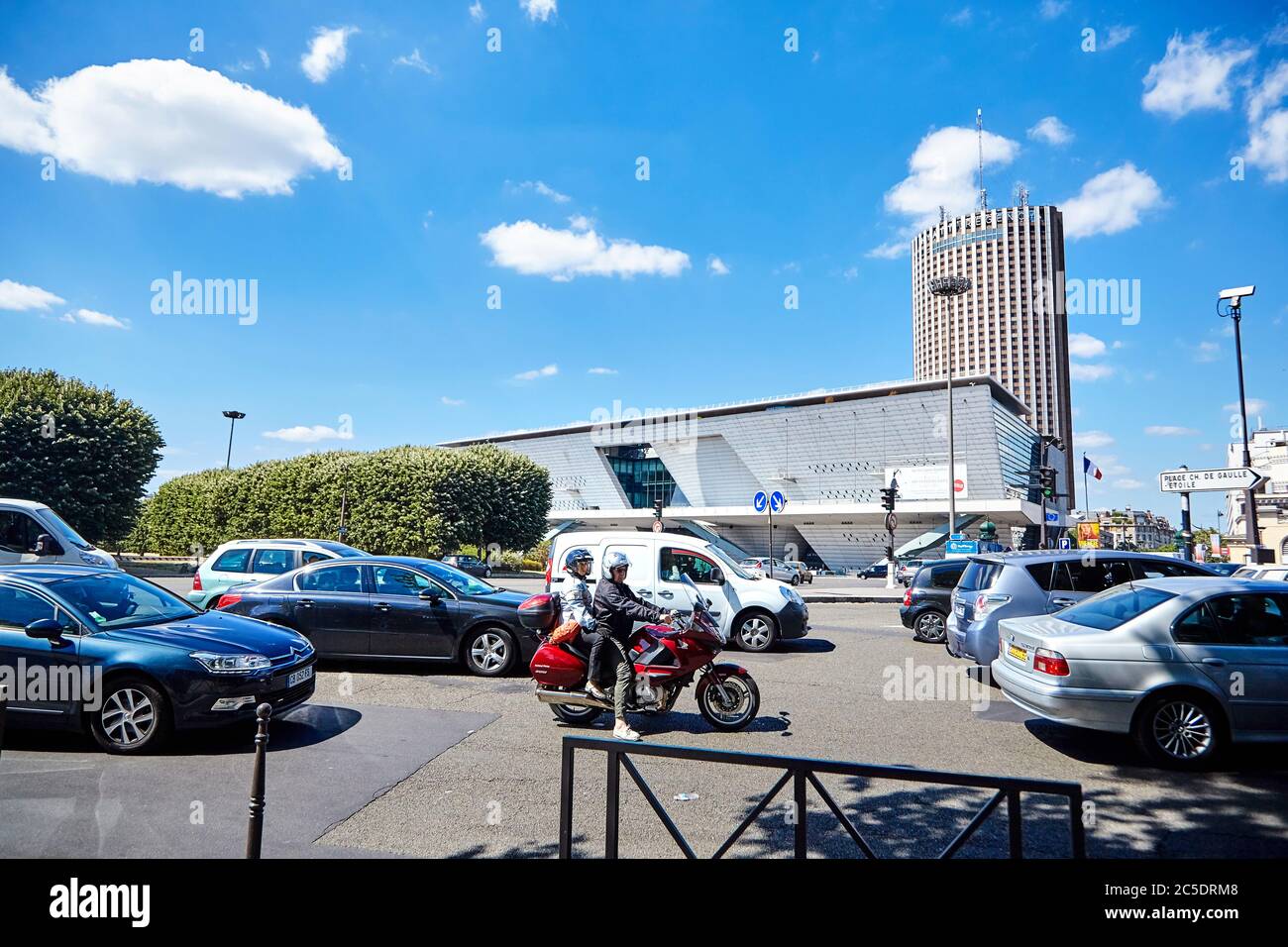 Paris, France - June 19, 2015: Standing transport on the city street. Motorcycle and cars Stock Photo
