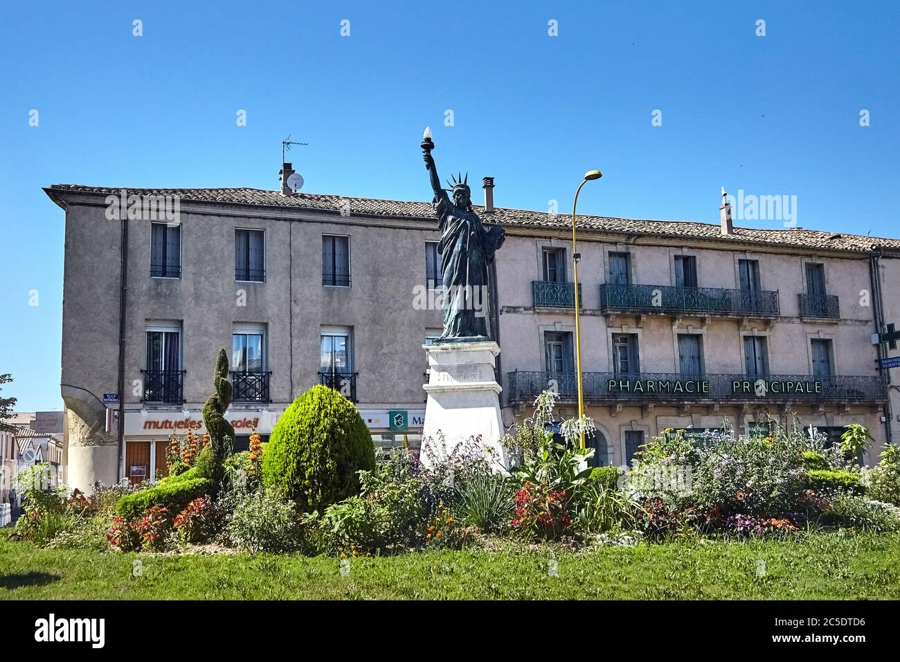 Lunel, France - June 24, 2015: Small replica of the Statue of Liberty of Auguste Bartholdi on the Place de la Republique Stock Photo