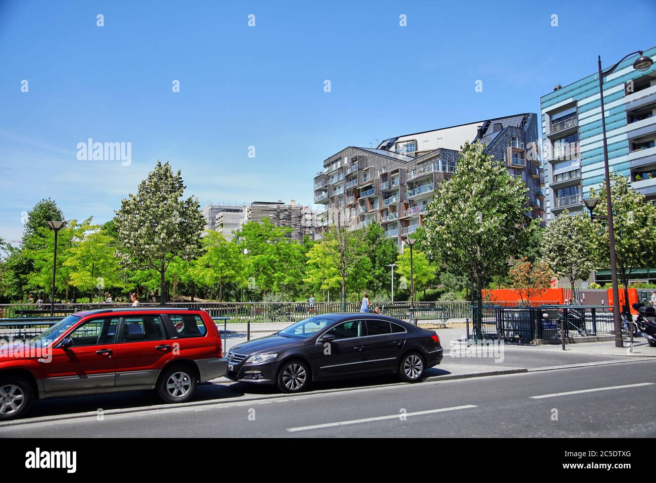 Paris, France - June 28, 2015: Eco-Quartier Clichy-Batignolles. New Modern Architecture. Park Martin Luther King. Parked cars Stock Photo