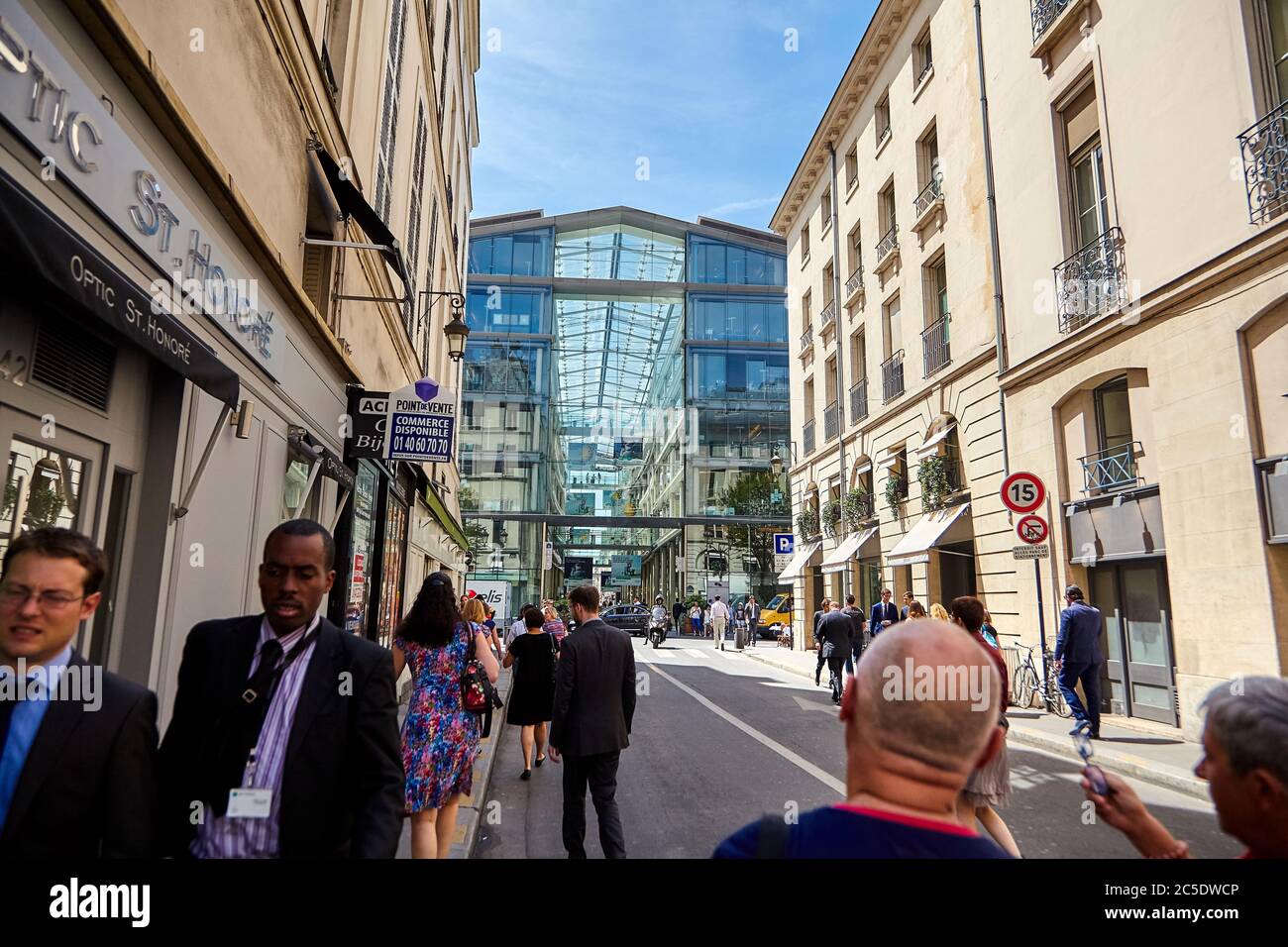 Paris, France - June 29, 2015: Rue du Marché Saint-Honoré. Passage des Jacobins. View of the glass facade of the building with many shops and offices. Stock Photo