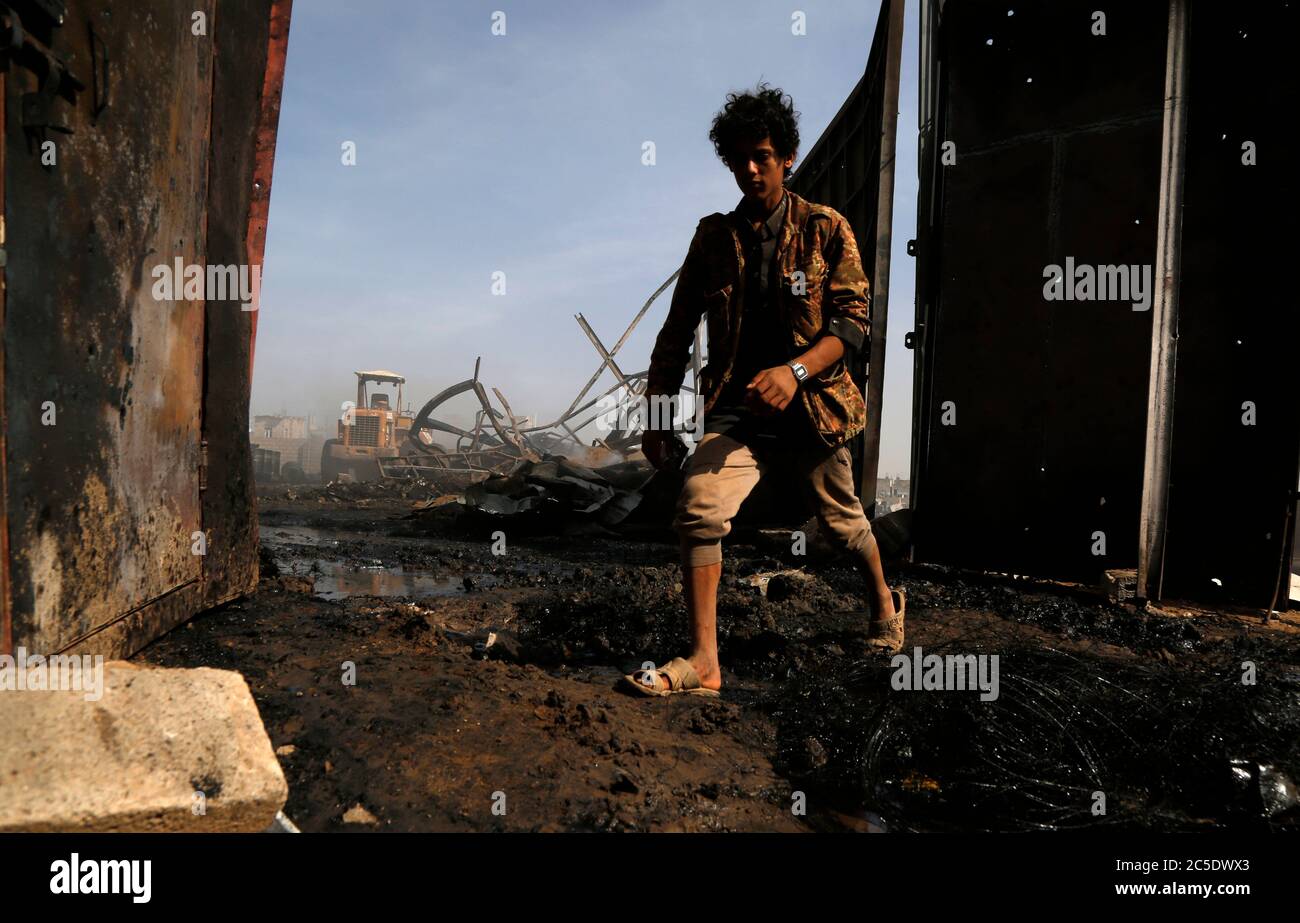 Sanaa, Yemen. 2nd July, 2020. A boy walks at a site of airstrikes in Sanaa, Yemen, on July 2, 2020. The Saudi-led coalition on Wednesday launched a series of airstrikes on the Yemeni capital Sanaa, which is under Houthi control, the Houthi-run al-Masirah TV reported. Credit: Mohammed Mohammed/Xinhua/Alamy Live News Stock Photo