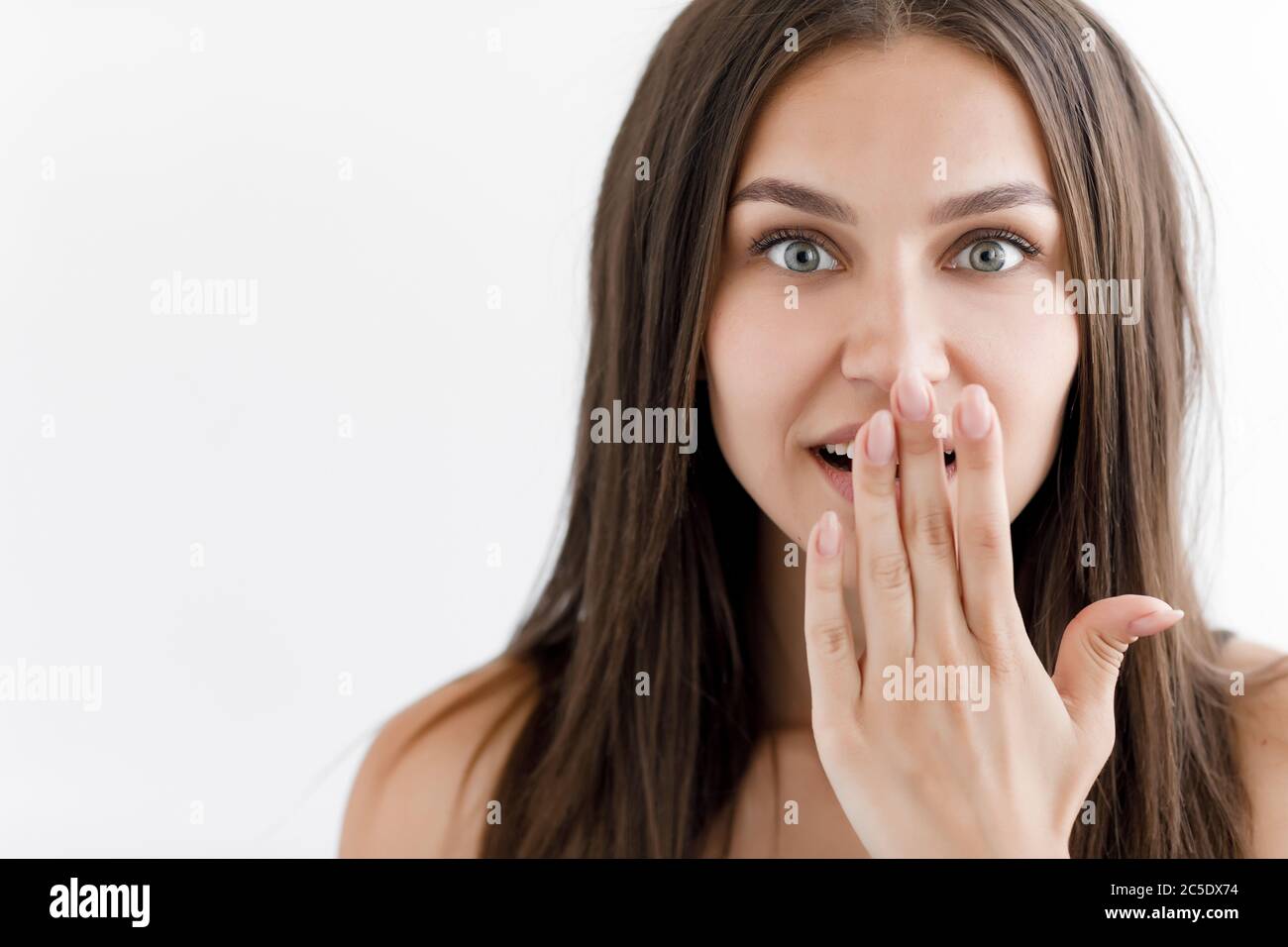 Surprised young woman portrait, beautiful emotional girl Stock Photo