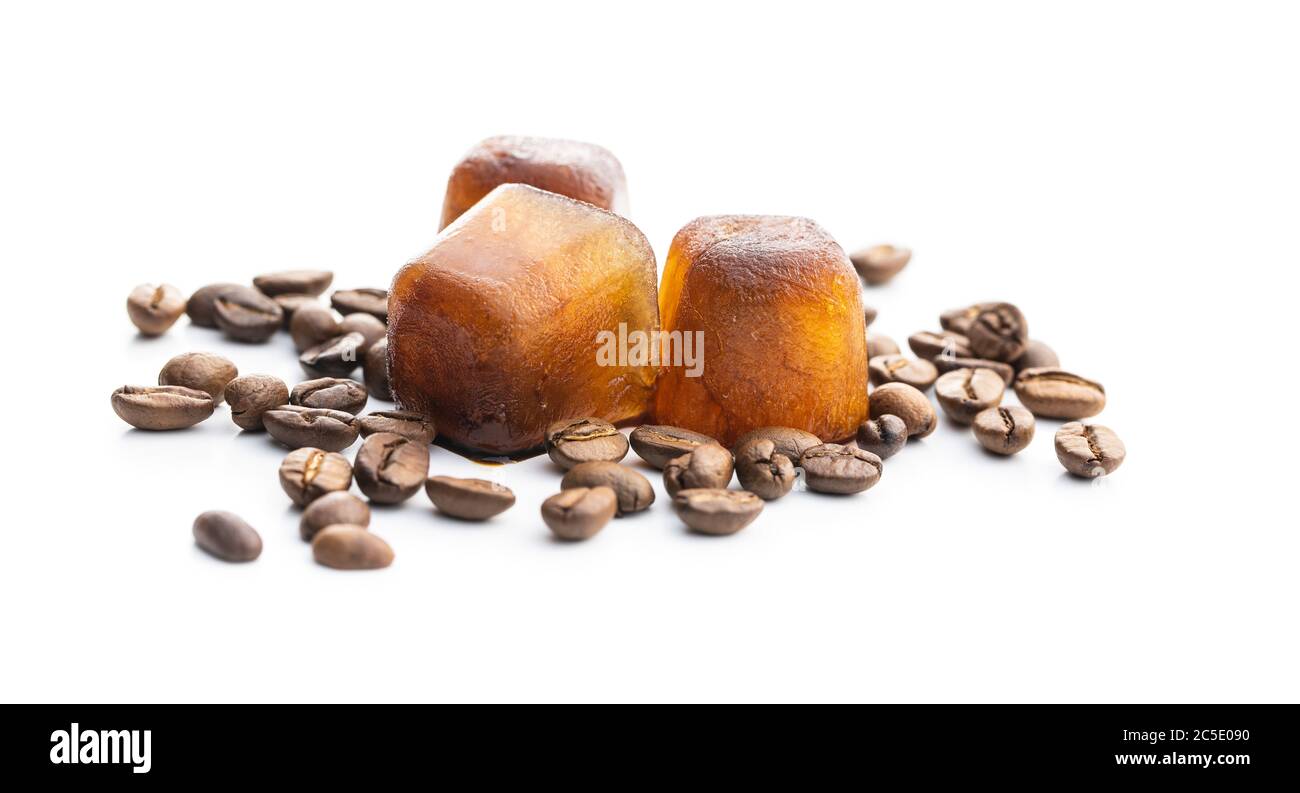 Frozen coffee. Coffee ice cubes and coffee beans isolated on white