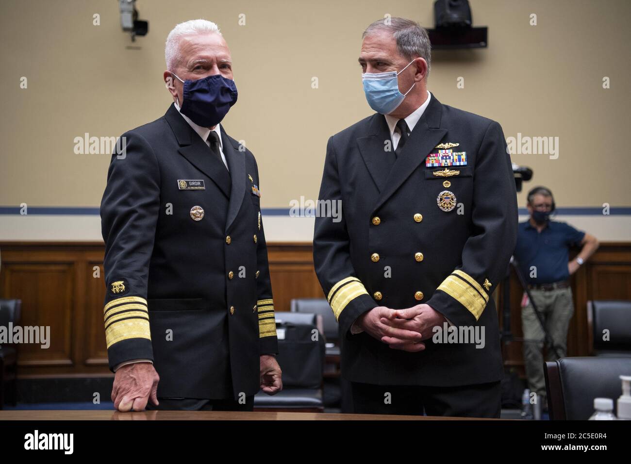 Washington, United States. 02nd July, 2020. Admiral Brett P. Giroir, M.D., Assistant Secretary for Health, left, talks with Rear Adm. John Polowczyk, leader of the Supply Chain Stabilization Task Force and vice director of logistics of the Joint Chiefs of Staff, before the start of a House Oversight and Reform Committee hearing on 'The Administration's Efforts to Procure, Stockpile, and Distribute Critical Supplies' in the Capitol in Washington, DC on Thursday, July 2, 2020. Pool Photo by Caroline Brehman/UPI Credit: UPI/Alamy Live News Stock Photo