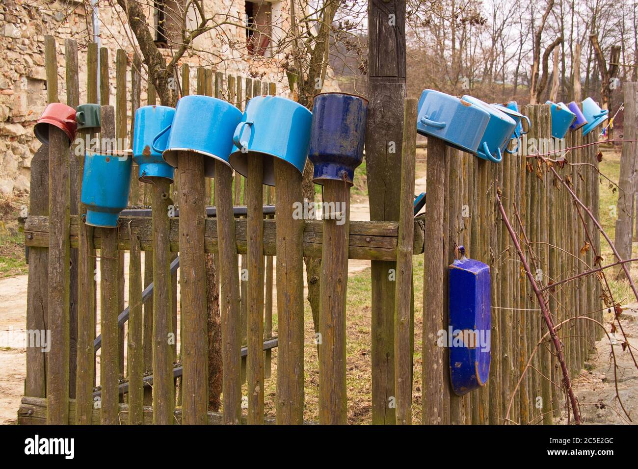 Old pots on a wooden fence near Zboreny Kostelec in Czech republic,Europe Stock Photo