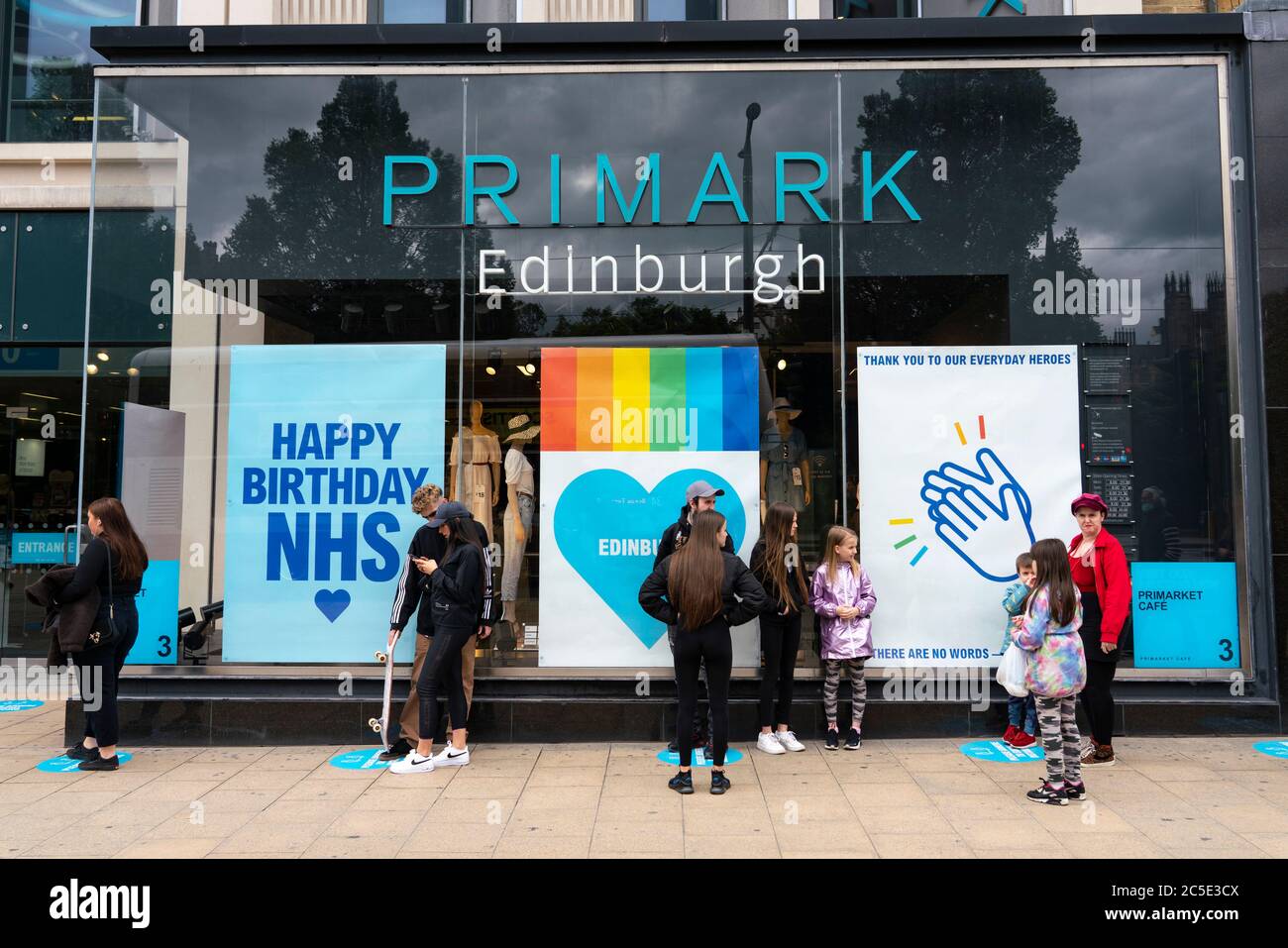 Edinburgh, Scotland, UK. 2 July, 2020. Good weather brought many shoppers out onto Princes Street in Edinburgh. Still busy with people queuing around the block was Primark.  Iain Masterton/Alamy Live News Stock Photo