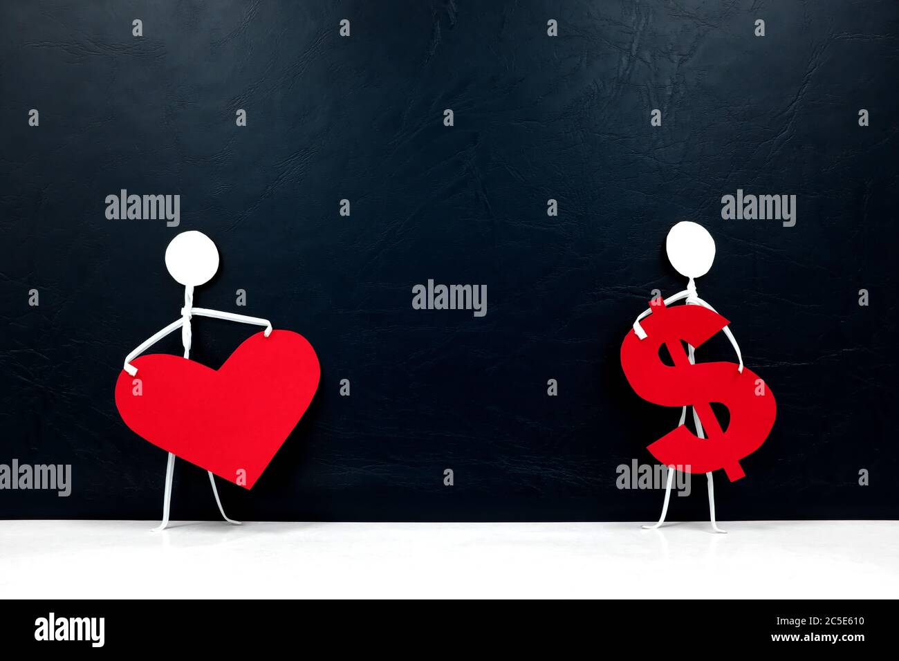 Human Stick Figures Holding A Red Heart Shape And A Dollar Sign Money Versus Love Family Or Career And Health Over Economy Concept Stock Photo Alamy