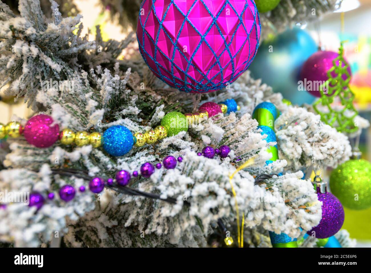 Christmas and New Year holiday decorations background. Detail of Christmas tree with festive balls and ornaments. Beautiful card of Christmas theme. S Stock Photo