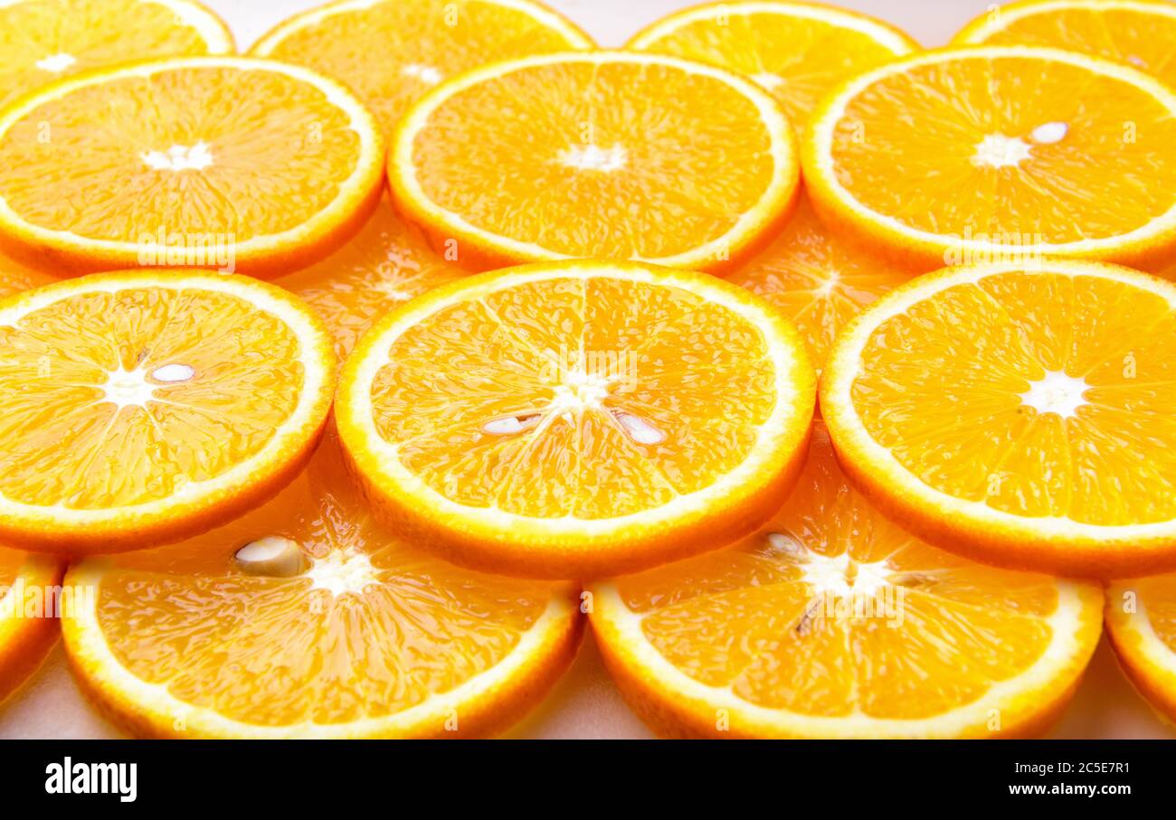 Fresh orange slices, orange background Stock Photo