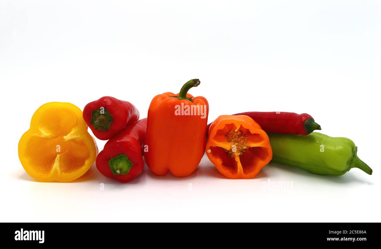 Composition of several sweet peppers and their halves of different