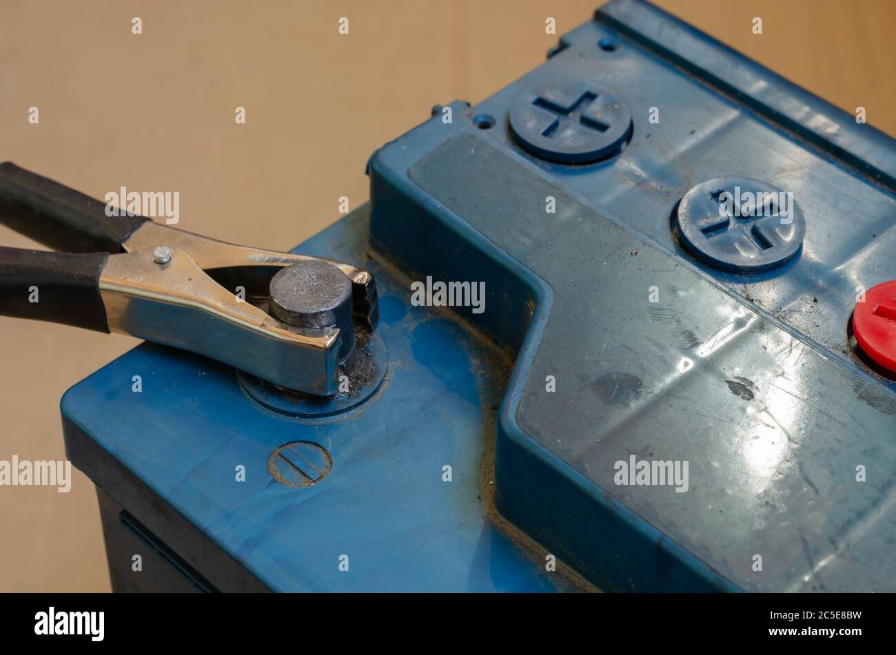 Negative car battery terminal with clip. The process of charging a 12