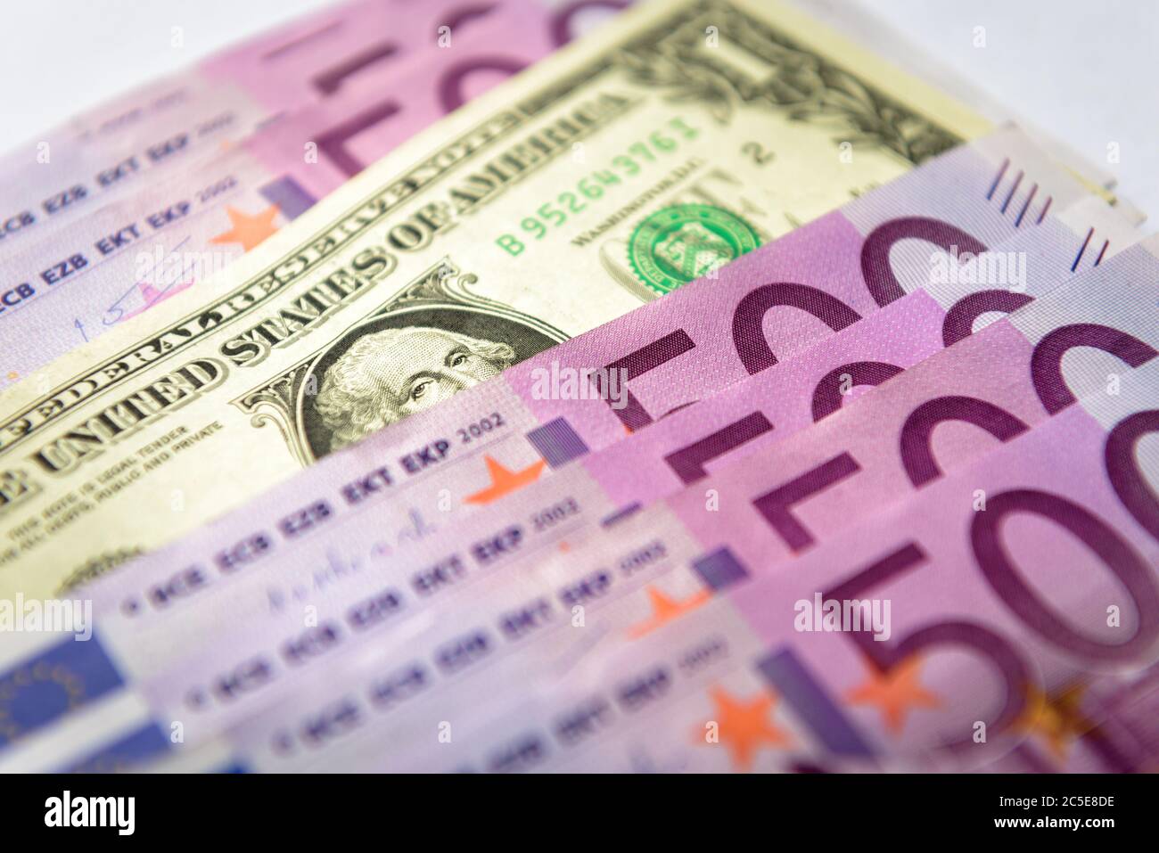 500 euro money banknotes versus 1 dollar. Five hundred notes of European Union contra American currency. Fan with money cash close-up. Concept of worl Stock Photo