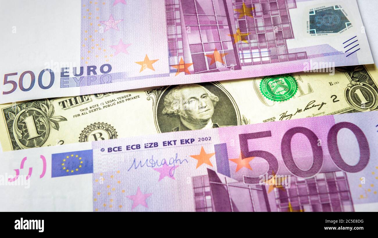 1 dollar bill versus 500 euro money banknotes. Top view of money cash close-up. Five hundred notes of European Union contra American currency. Concept Stock Photo