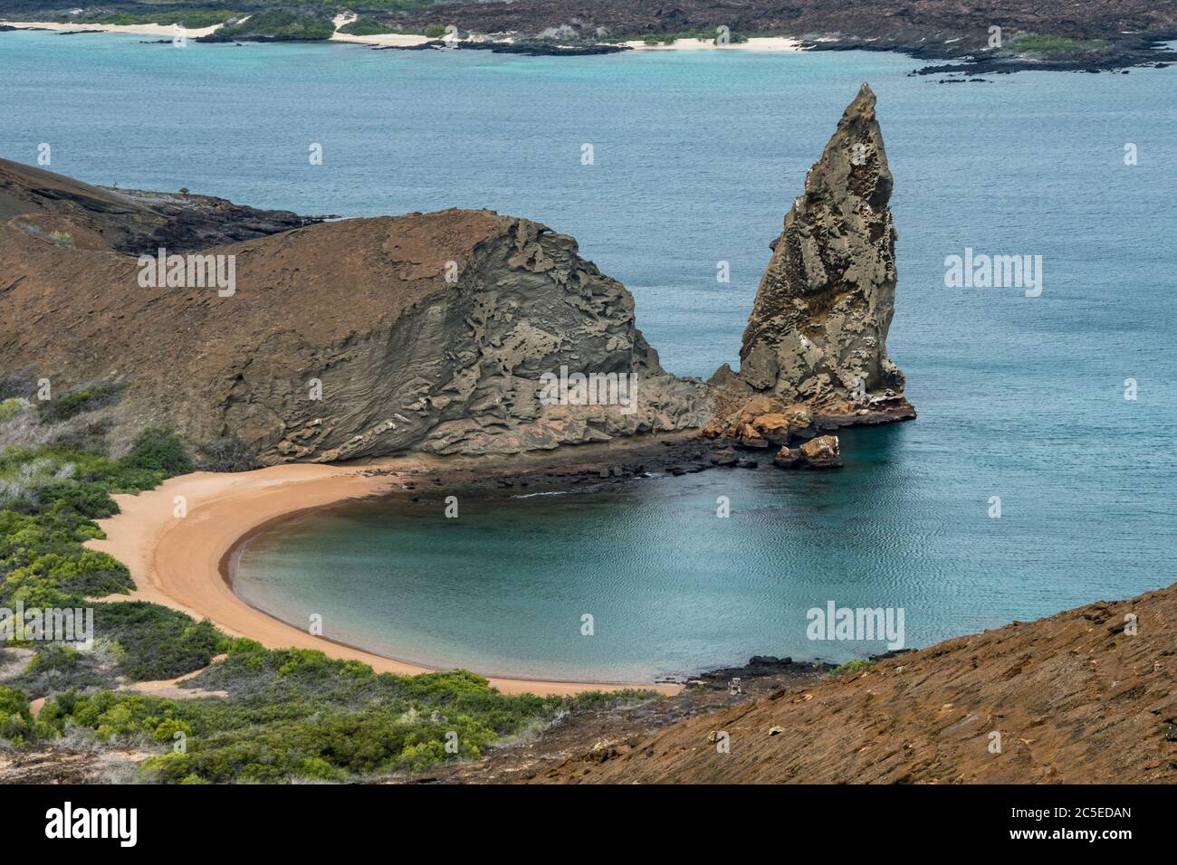 From the tops of the crater on the island Bartolomé you can admire the panorama on the Pinnacle Rock and the Golden Beach, Galapagos Stock Photo
