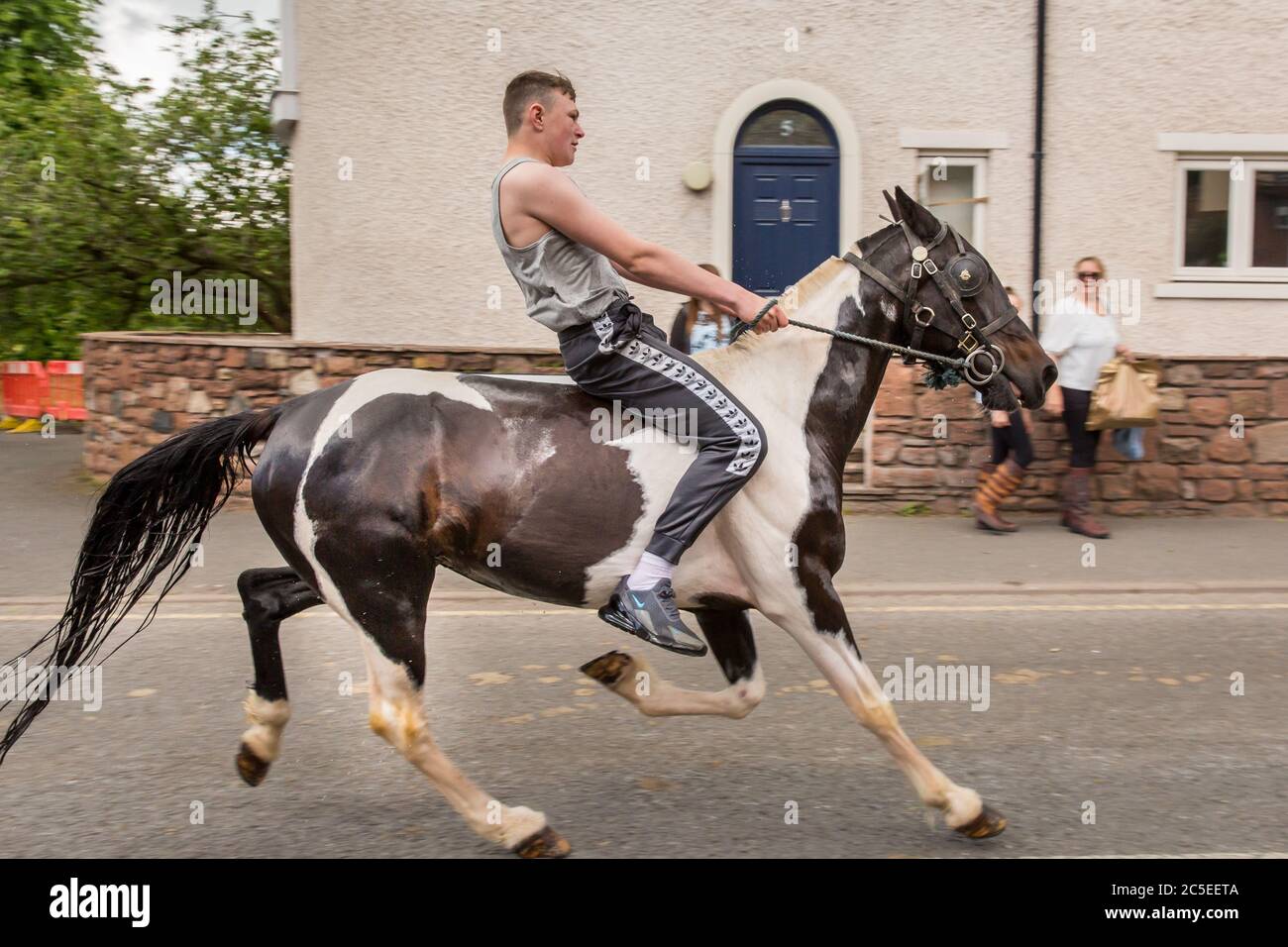 A traveller riding bareback at Appleby Horse Fair, Cumbria. A gathering