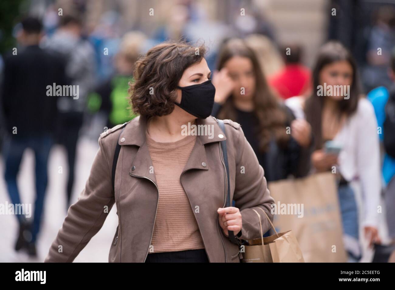 Glasgow, Scotland, UK. 2nd July, 2020. Pictured: Scenes from Glasgows style mile, Buchanan Street shopping area, where more people are seen wearing face masks or home made face coverings. Nicola Sturgeon announced earlier today that wearing a face covering is to become mandatory in shops from 10th July next week. Face coverings are already mandatory when taking public transport in a bid to slow down the spread of coronavirus. Credit: Colin Fisher/Alamy Live News Stock Photo