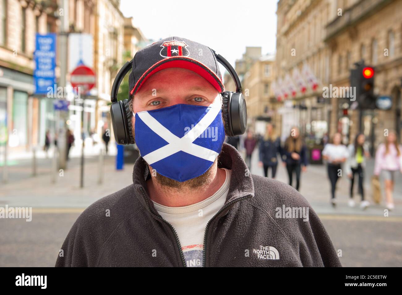 Glasgow, Scotland, UK. 2nd July, 2020. Pictured: A man seen wearing a St  Andrews Scotland Flag design face mask. Scenes from Glasgows style mile,  Buchanan Street shopping area, where more people are