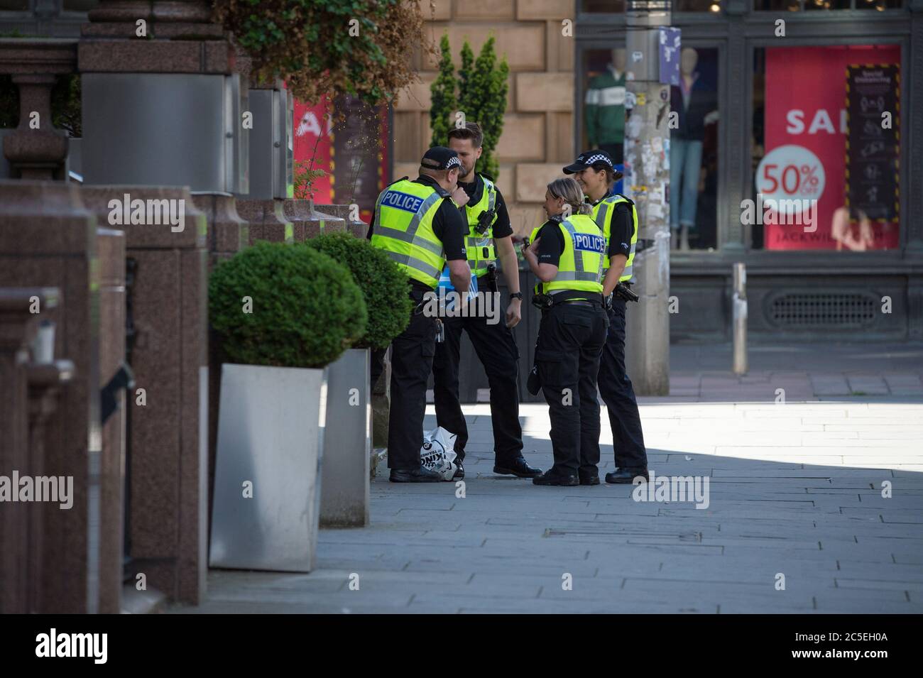 Glasgow, Scotland, UK. 2nd July, 2020. Pictured: Police officers are called to attend a suspect package which was reported on the corner of Buchanan Street and ST Vincent Street in Glasgow. Credit: Colin Fisher/Alamy Live News Stock Photo